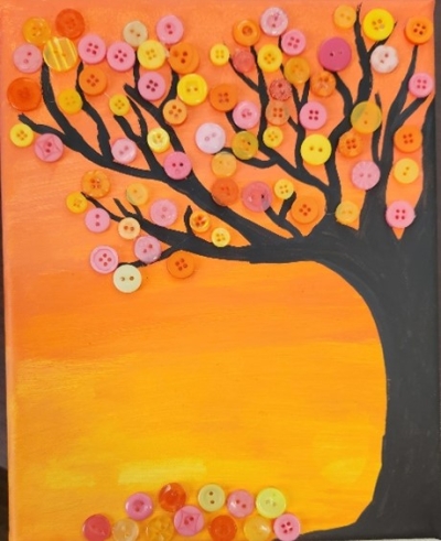 Painting of a sunset colored background with a tree and button leaves 