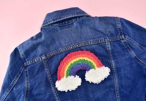 Rainbow punch needle patch on jean jacket