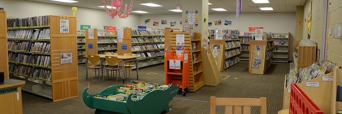 Randall Oaks library interior showing tables and bookshelves