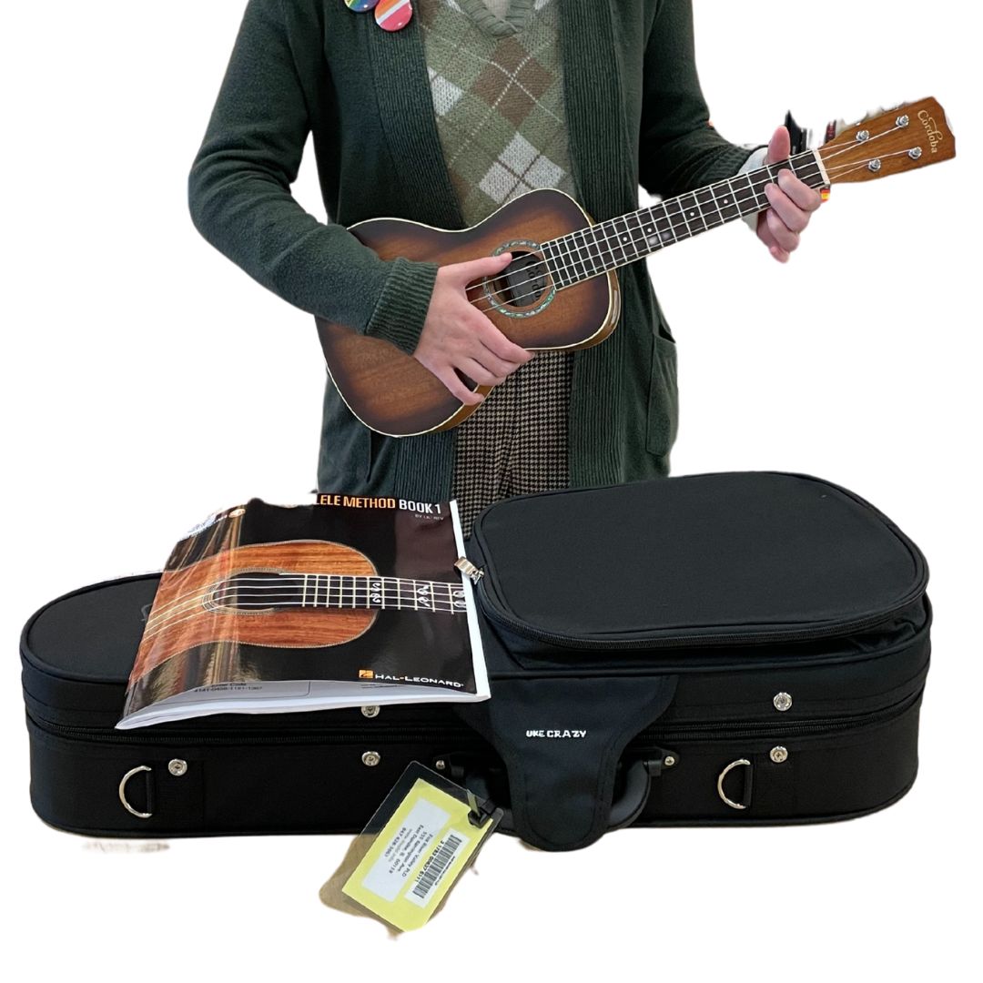 Ukulele Kit with someone holding the ukulele