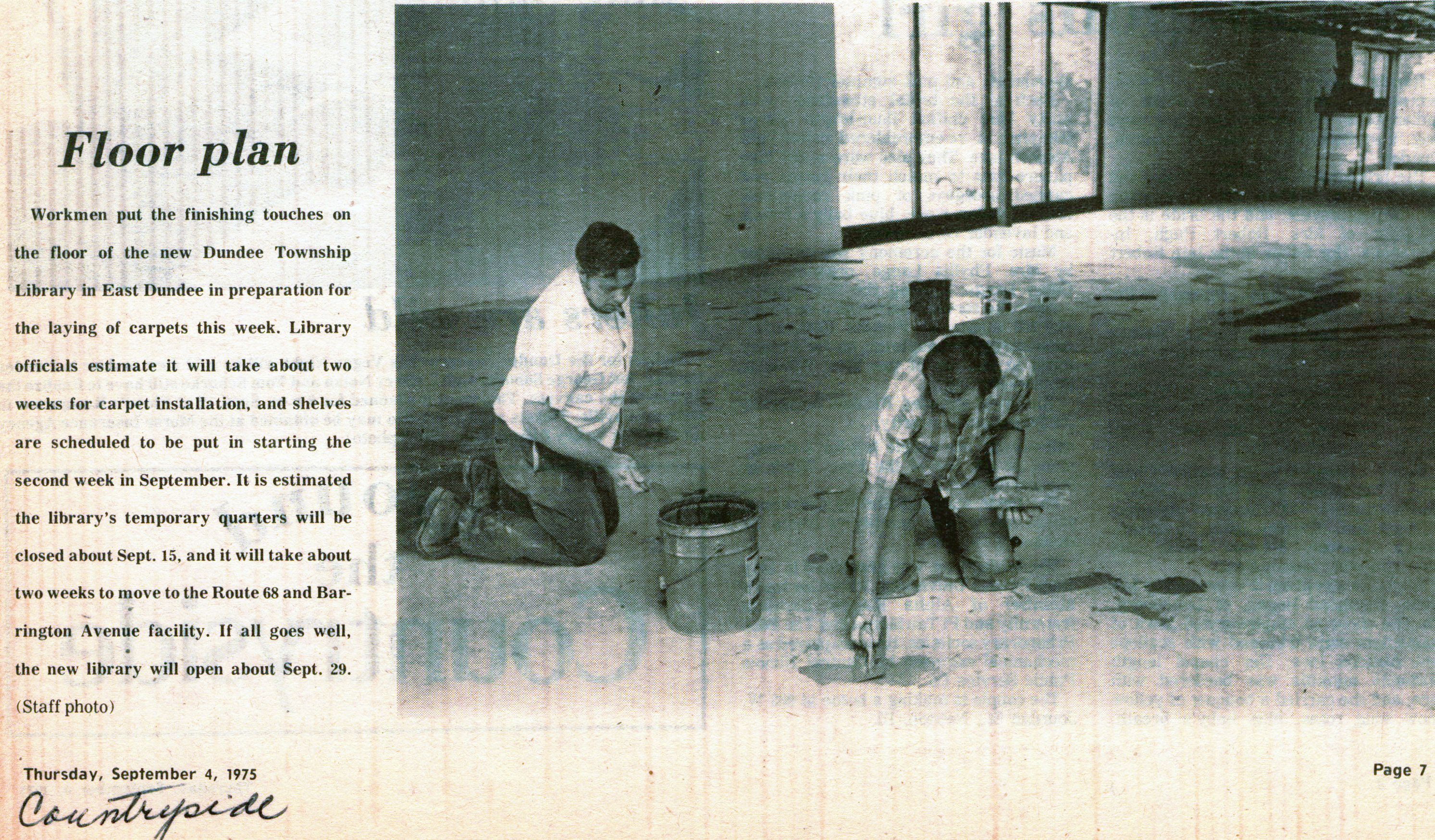 1975 - In the final stages of construction, workers prepare the floors for new carpeting inside the newly built Dundee Library prior to its opening.