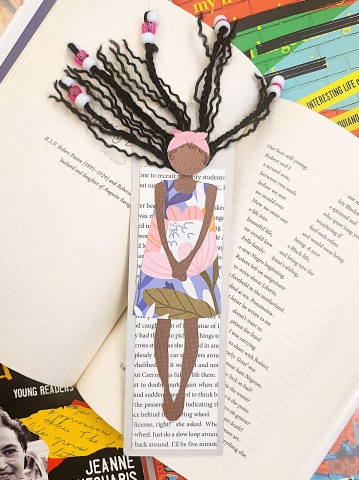 mix media bookmark example displayed on top of various text from black authors