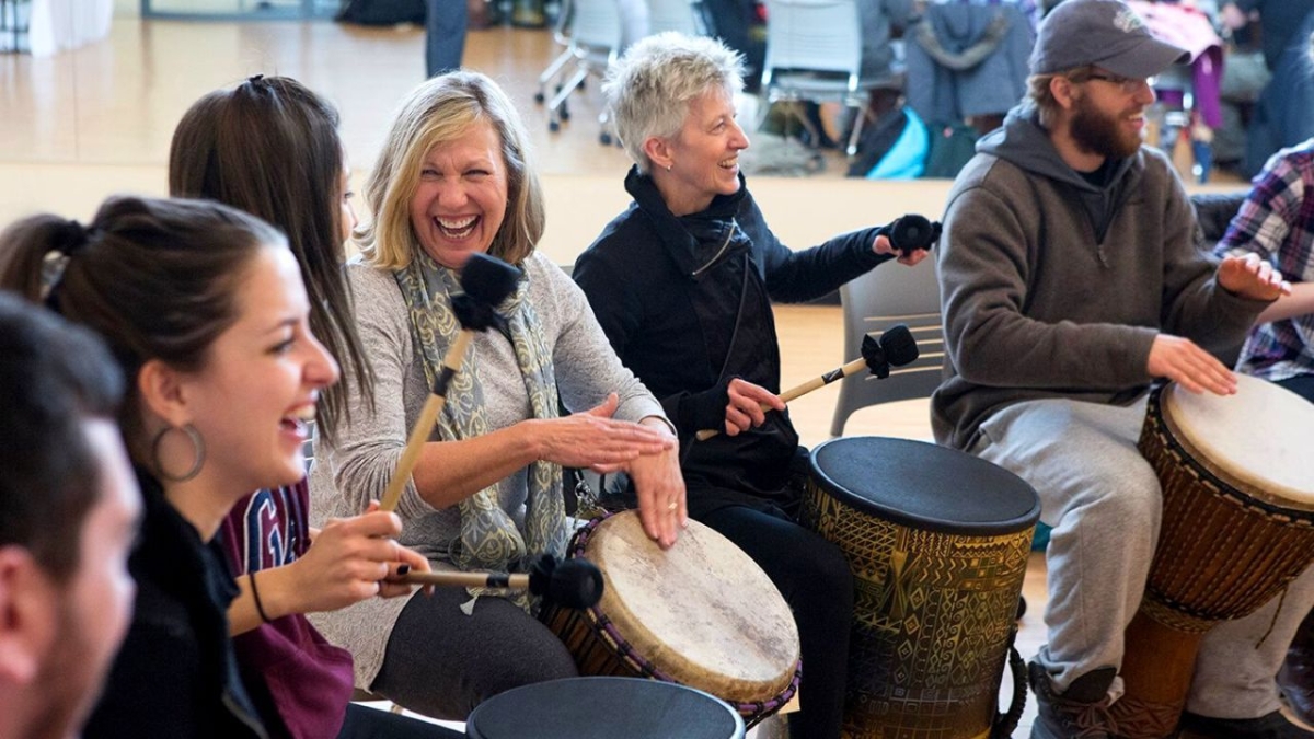 people having fun in drumming circle