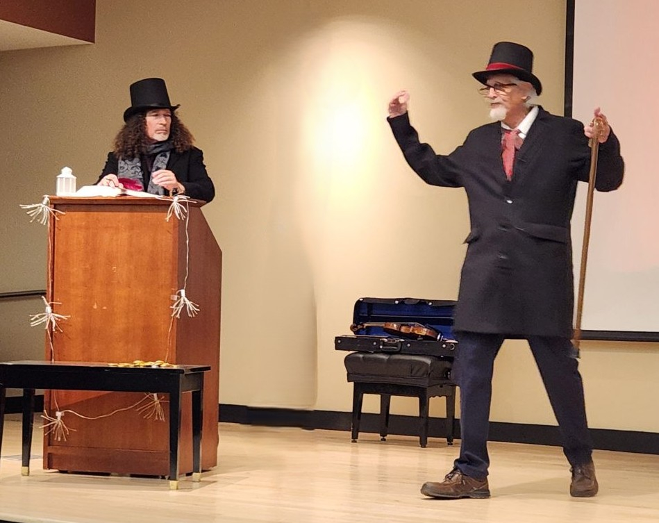 Two men in period costume presenting and acting